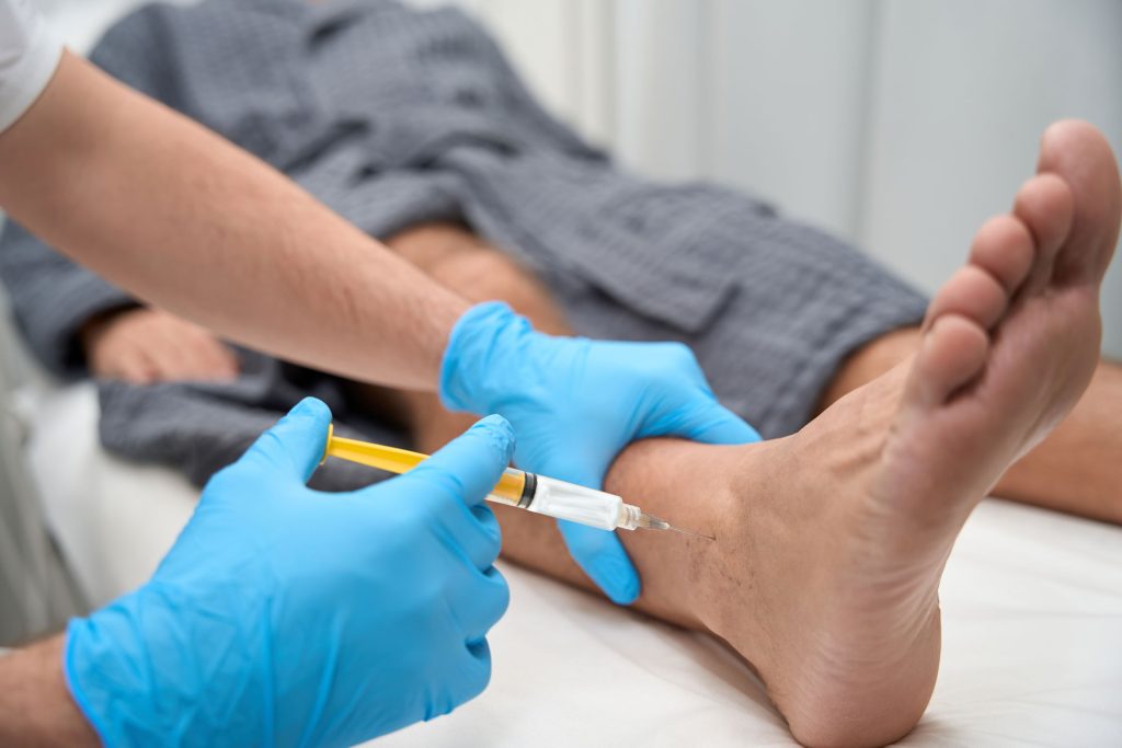 Biopsy collection on patient's feet.